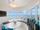 Bright breakfast nook with water views, unique lighting, and custom bench seating at 2 Oceans West Blvd # 2006, Daytona Beach Shores, FL 32118