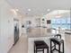 Modern kitchen with stainless appliances and breakfast nook with water view at 2 Oceans West Blvd # 2006, Daytona Beach Shores, FL 32118