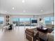 Bright and spacious living room with large windows showcasing panoramic ocean views at 2 Oceans West Blvd # 2006, Daytona Beach Shores, FL 32118