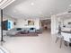 Spacious open-concept living area with sleek tile floors and contemporary decor at 2 Oceans West Blvd # 2006, Daytona Beach Shores, FL 32118