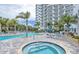 Relaxing pool area with a jacuzzi and chairs perfect for residents and guests to use at 2 Oceans West Blvd # 2006, Daytona Beach Shores, FL 32118