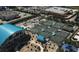 Overhead view of meticulously maintained tennis courts and clubhouse in complex at 2 Oceans West Blvd # 2006, Daytona Beach Shores, FL 32118