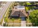 Aerial view of a home with a screened pool and beautiful landscaping at 201 Twelve League Cir, Casselberry, FL 32707