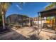 Backyard featuring a screened-in pool and spa with a shaded dining area and grill at 201 Twelve League Cir, Casselberry, FL 32707