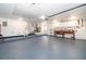 Spacious garage with ample storage and a functional work bench area at 201 Twelve League Cir, Casselberry, FL 32707
