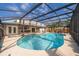 Relaxing screened-in pool with attached spa and outdoor bar, perfect for summer fun at 201 Twelve League Cir, Casselberry, FL 32707