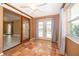 Bright sunroom with tiled floors, multiple windows overlooking the pool, and access to the living room at 201 Twelve League Cir, Casselberry, FL 32707