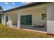 Covered back porch boasts plenty of space and comfortable seating; perfect for outdoor enjoyment at 20446 Quinlan St, Orlando, FL 32833