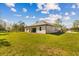 Beautifully landscaped backyard offers ample space for outdoor activities and relaxation at 20446 Quinlan St, Orlando, FL 32833