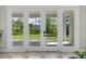 Interior view of backyard, through double glass doors that let in natural light at 20446 Quinlan St, Orlando, FL 32833