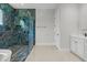 Modern bathroom featuring glass shower, sleek vanity, and neutral color palette at 20446 Quinlan St, Orlando, FL 32833