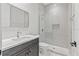 Modern bathroom featuring a shower with glass door, sleek vanity, and stylish fixtures at 20446 Quinlan St, Orlando, FL 32833