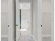 Bright bathroom featuring marble floors and a doorway view of the shower and soaking tub at 20446 Quinlan St, Orlando, FL 32833