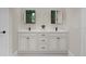 Elegant bathroom vanity with double sinks, marble countertop, and ample storage at 20446 Quinlan St, Orlando, FL 32833