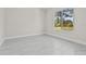 Bright and airy bedroom with neutral walls, large window, and light gray floors at 20446 Quinlan St, Orlando, FL 32833