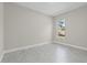 Minimalist bedroom featuring natural light and light gray floors at 20446 Quinlan St, Orlando, FL 32833