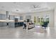 Bright open-concept living space with modern appliances and a cozy seating area with natural light at 20446 Quinlan St, Orlando, FL 32833