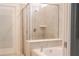Bright and airy bathroom featuring a tiled shower, a tub, and pristine white trim at 2123 Lelani Cir, Davenport, FL 33897