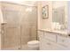 Bathroom with a glass-enclosed shower, marble vanity, and tasteful decor at 2123 Lelani Cir, Davenport, FL 33897