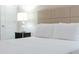 Stylish bedroom features comfortable bed and modern bedside lighting at 2123 Lelani Cir, Davenport, FL 33897