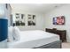 This bedroom features a large comfortable bed and serene ambiance, perfect for relaxation and rest at 2123 Lelani Cir, Davenport, FL 33897