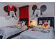 Fun themed bedroom with cartoon decor and comfortable beds, perfect for a playful atmosphere at 2123 Lelani Cir, Davenport, FL 33897