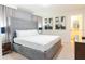 This bedroom features a large comfortable bed and serene ambiance, perfect for relaxation and rest at 2123 Lelani Cir, Davenport, FL 33897