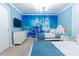 Bright bedroom features a Cinderella mural, chandelier, and two twin beds with blue accents at 2123 Lelani Cir, Davenport, FL 33897