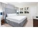 Stylish bedroom featuring a large bed, modern art, and elegant bedside tables at 2123 Lelani Cir, Davenport, FL 33897