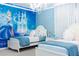 Whimsical bedroom decorated with a Cinderella theme, featuring a mural and chandelier at 2123 Lelani Cir, Davenport, FL 33897