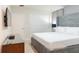 Serene bedroom featuring a comfortable bed, a dresser, and an entertainment unit with a TV screen at 2123 Lelani Cir, Davenport, FL 33897