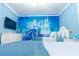 Charming bedroom with a Disney princess mural, comfortable bed, and soft lighting creating a serene ambiance at 2123 Lelani Cir, Davenport, FL 33897
