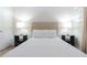 Well lit bedroom showcases contemporary furniture and modern bedside lighting at 2123 Lelani Cir, Davenport, FL 33897