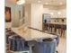 Open dining room featuring a large table, velvet chairs, and a modern lion portrait at 2123 Lelani Cir, Davenport, FL 33897