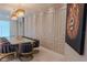 Dining room featuring a large table, velvet chairs, chandelier lighting, and a modern lion portrait at 2123 Lelani Cir, Davenport, FL 33897