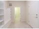 Functional entryway featuring built-in storage and easy access to the laundry room at 2123 Lelani Cir, Davenport, FL 33897