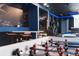 Fun game room featuring a foosball table, bar seating, and Star Wars themed decor, perfect for entertainment at 2123 Lelani Cir, Davenport, FL 33897
