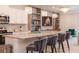 Kitchen with modern appliances, a central island with barstool seating, and elegant pendant lighting at 2123 Lelani Cir, Davenport, FL 33897