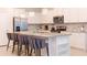 Spacious kitchen with stainless steel appliances, granite countertops, and bar seating at 2123 Lelani Cir, Davenport, FL 33897