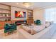 Inviting living room featuring a fireplace, built-in shelving, and stylish furniture at 2123 Lelani Cir, Davenport, FL 33897