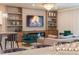 Stylish living room with a fireplace, modern shelving, and elegant decor for entertaining at 2123 Lelani Cir, Davenport, FL 33897