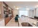 Open-concept living room with fireplace, elegant lighting, and contemporary furnishings at 2123 Lelani Cir, Davenport, FL 33897