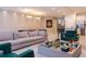 Spacious living room with modern furnishings, stylish decor, and custom wall paneling at 2123 Lelani Cir, Davenport, FL 33897