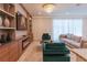 Cozy living room with a fireplace, entertainment center, and comfortable seating at 2123 Lelani Cir, Davenport, FL 33897