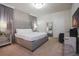 Modern bedroom with elegant decor, mirrored furniture, and a comfortable bed for a luxurious feel at 2123 Lelani Cir, Davenport, FL 33897