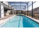 Enjoy this beautiful screened-in pool with clear blue water, a great place to relax and unwind at 2123 Lelani Cir, Davenport, FL 33897