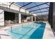 Screened-in pool area with outdoor seating, patio, hot tub, and privacy at 2123 Lelani Cir, Davenport, FL 33897