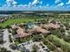 Aerial view of the community clubhouse showcasing beautiful landscape and resort-style pool at 223 Silver Maple Rd, Groveland, FL 34736