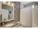 Well-lit bathroom with decorative tile, modern fixtures, and shower-tub combination at 223 Silver Maple Rd, Groveland, FL 34736