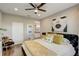 Stylish bedroom with a large decorative headboard and modern lighting at 223 Silver Maple Rd, Groveland, FL 34736